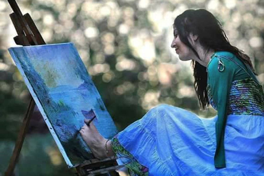Ellerini kaybeden ressam, ayaklarıyla sanatını icra ediyor